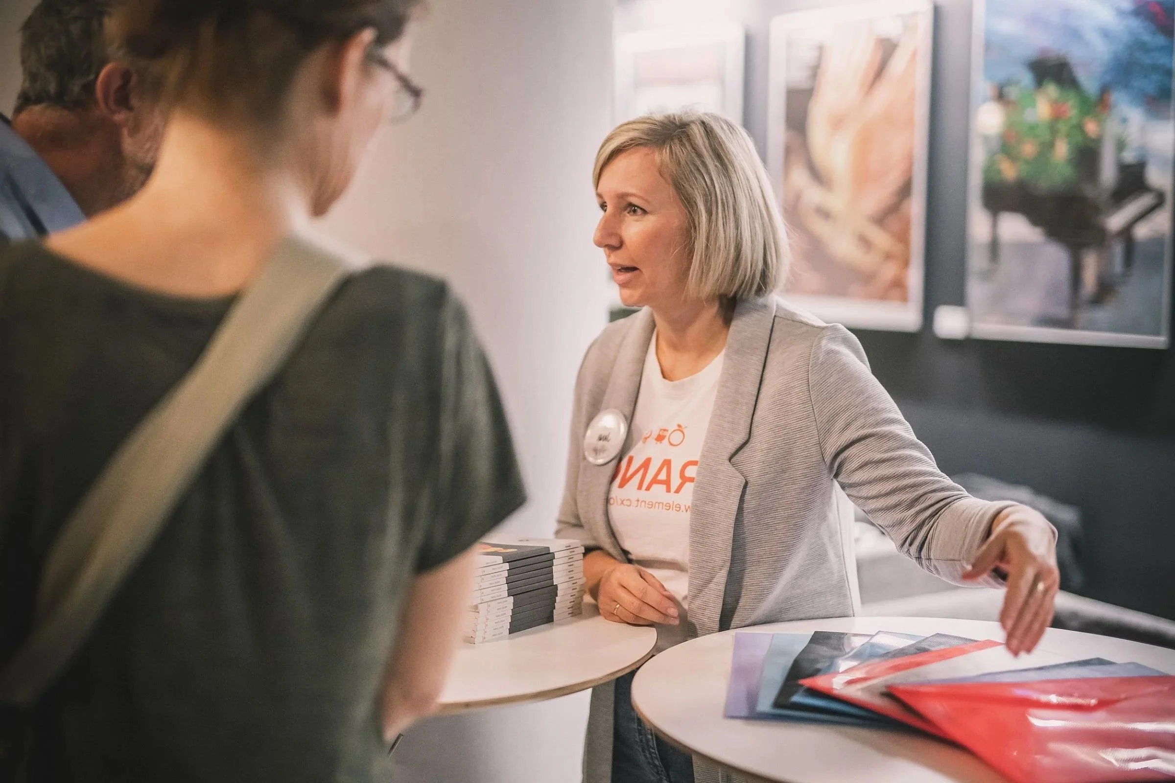 A woman talking about her project at a women leaders networking event.