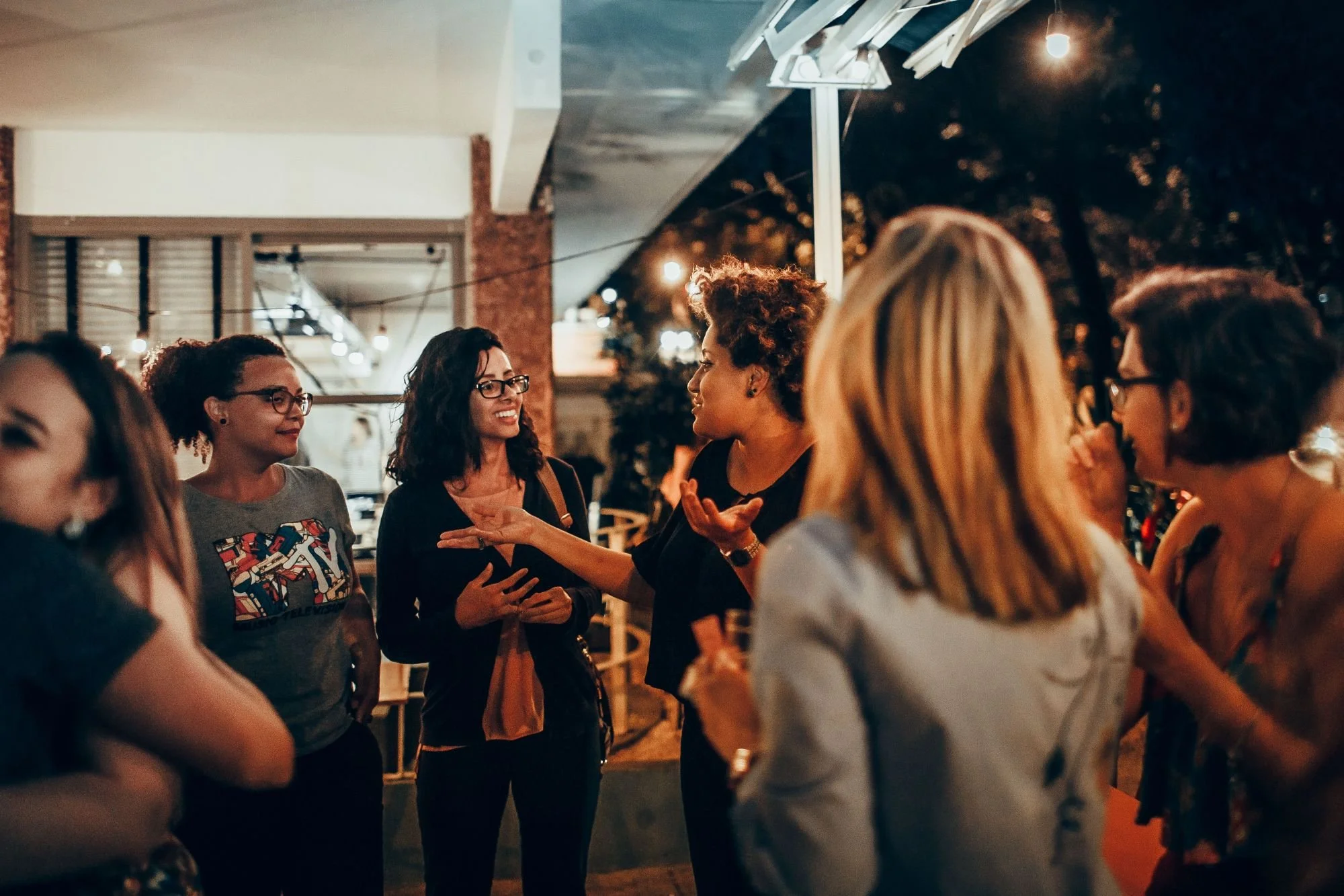 Women leaders talking and sharing experiences at a women in leadership event