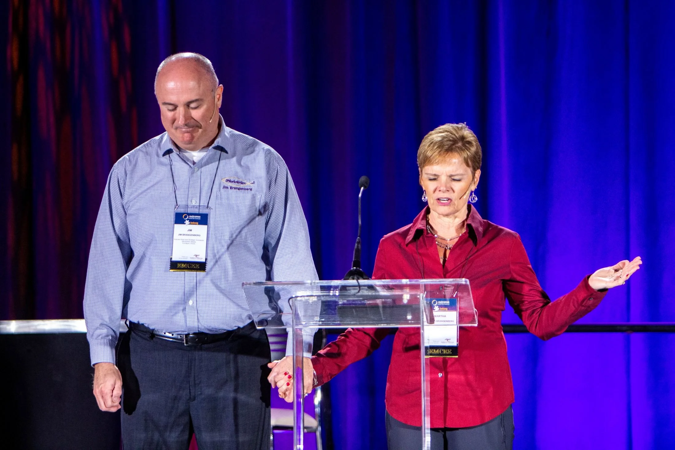 Martha Brangenberg and her husband praying at a women in leadership conference.