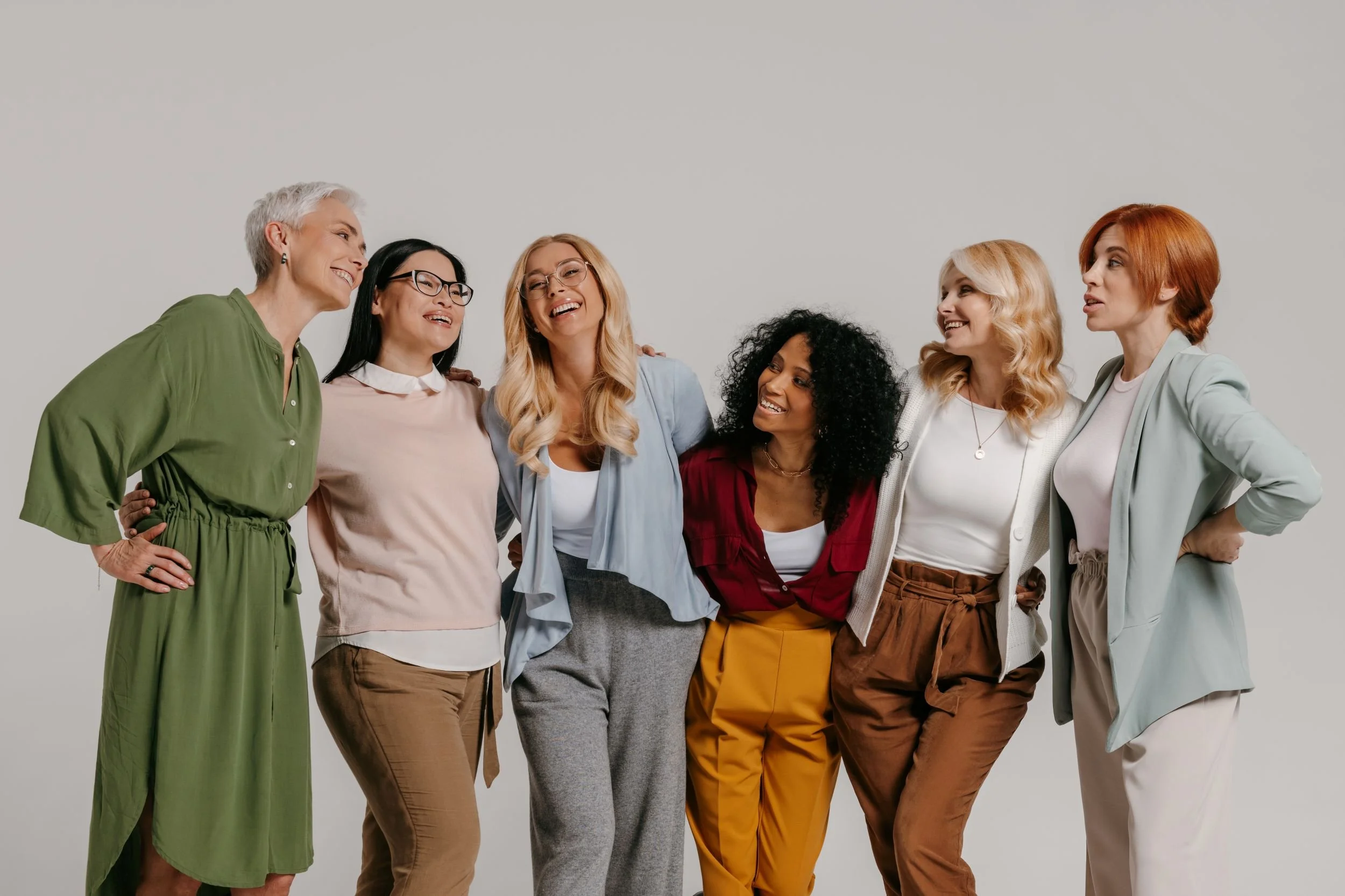 Women standing shoulder to shoulder.