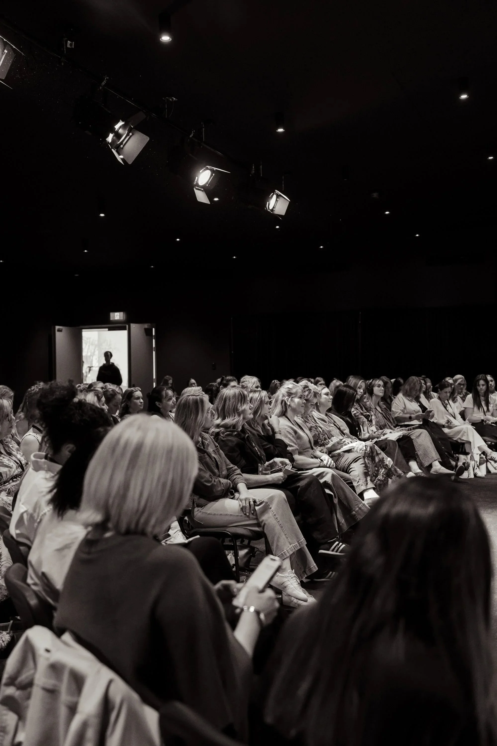 A audience of women leaders attending a women in leadership event.