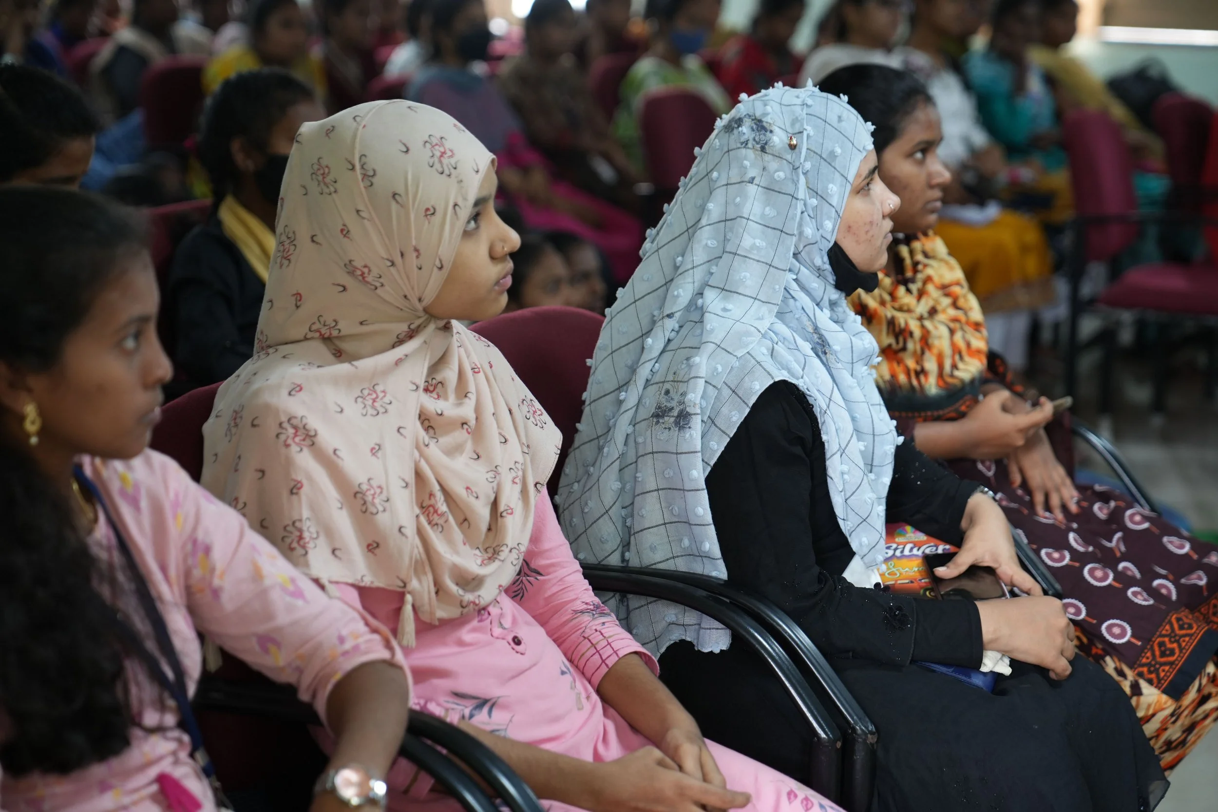 Women in Sri Lanka listening to a talk on leadersip development.