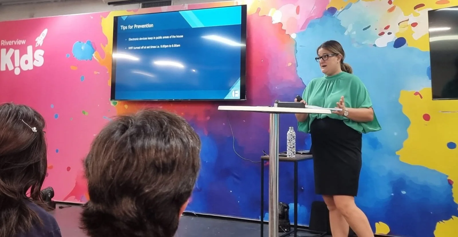 Rebekah Nijsen teaching leadership skills from stage.