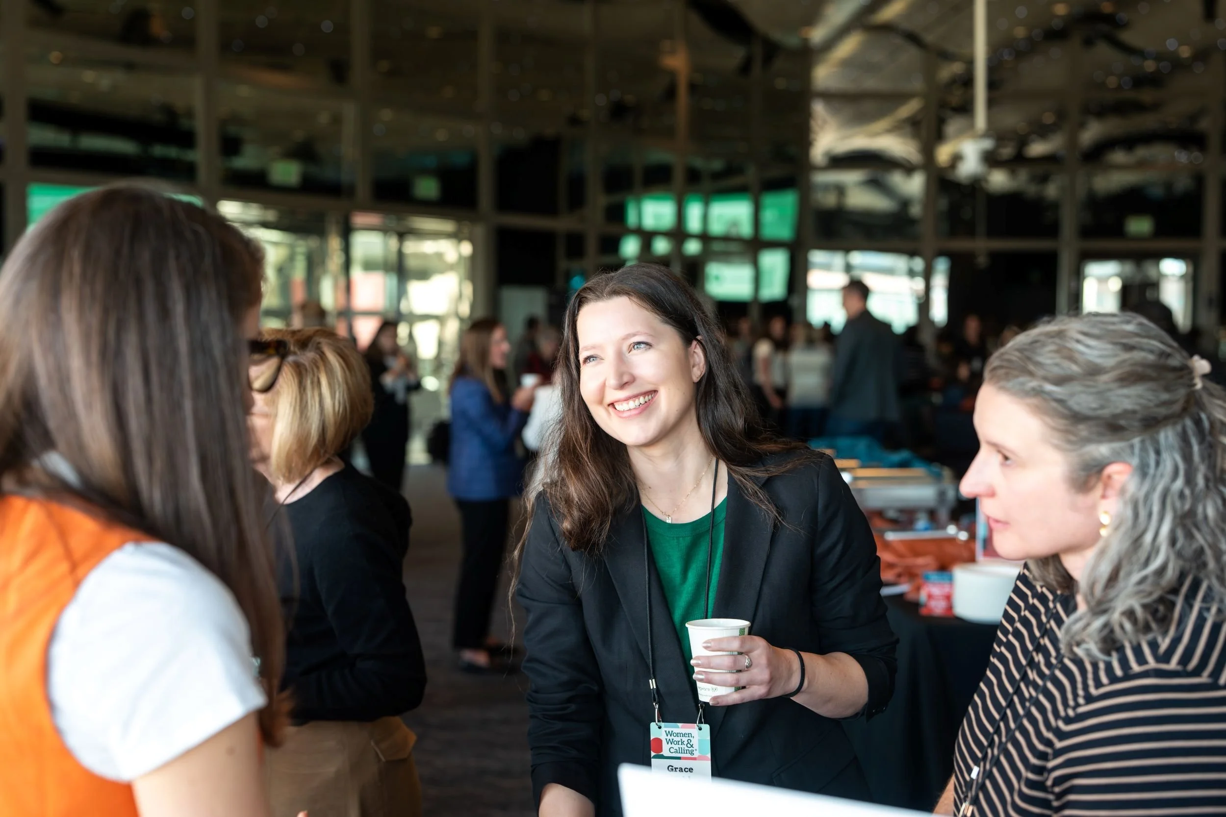 Women talking at a women leaders network event.