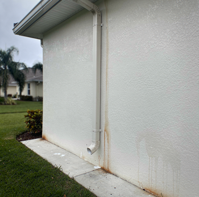 salt crust forming on weathered exterior painted wall