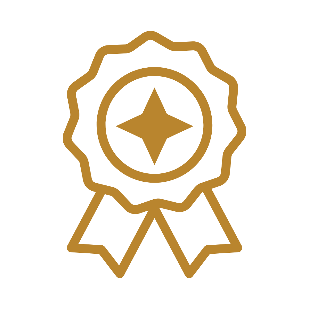 Gold award ribbon with a star in the center and two dangling ribbon ends.