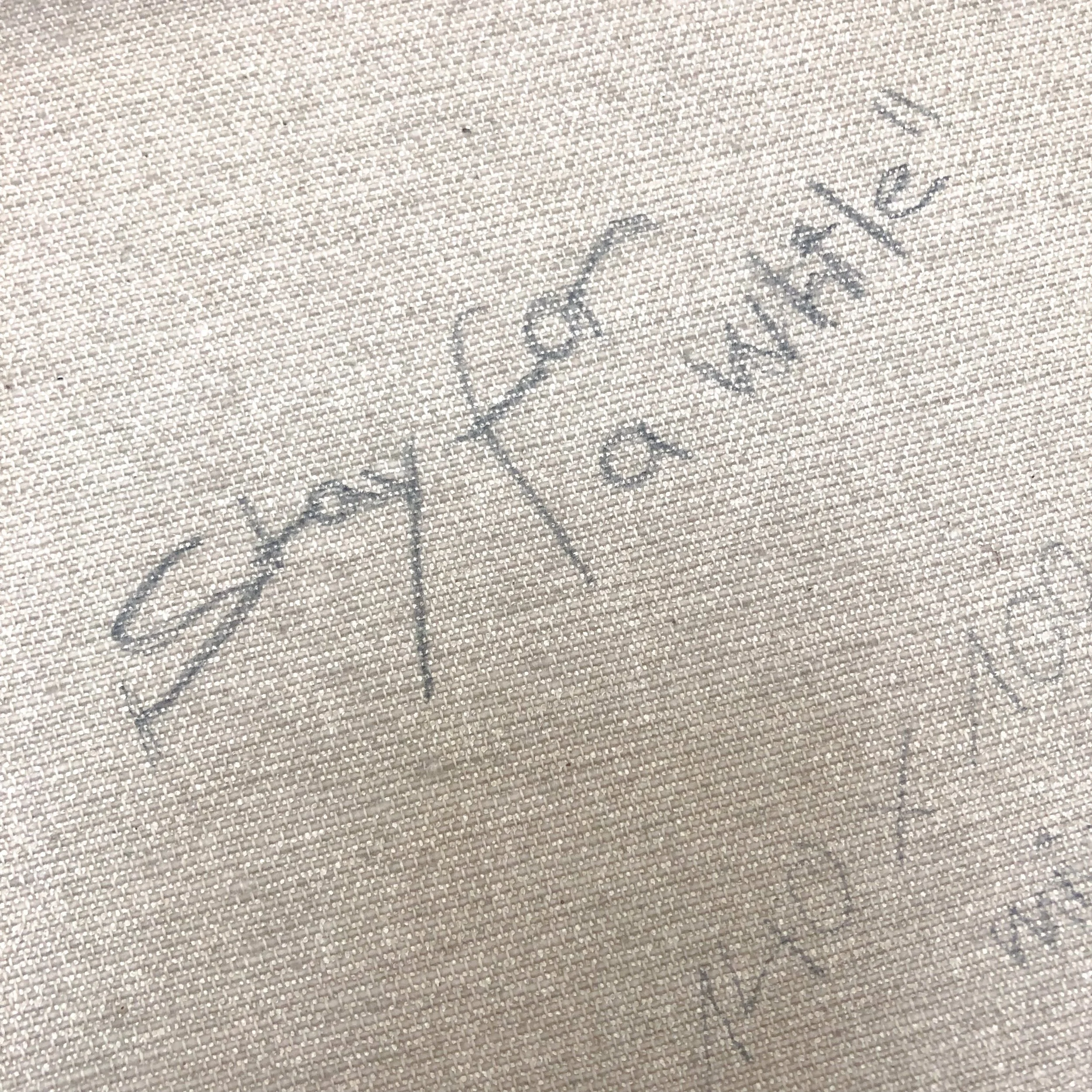 Nahaufnahme eines Stoffes mit einer handschriftlichen Beschriftung in schwarzem Filzstift. Kohlestift. Stay for a while