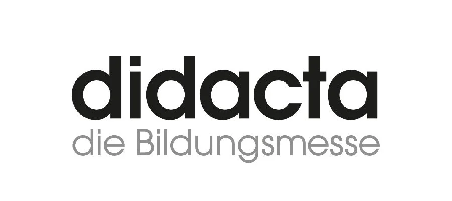 Logo mit dem Text "didacta die Bildungsmesse" in Schwarz und Grau.
