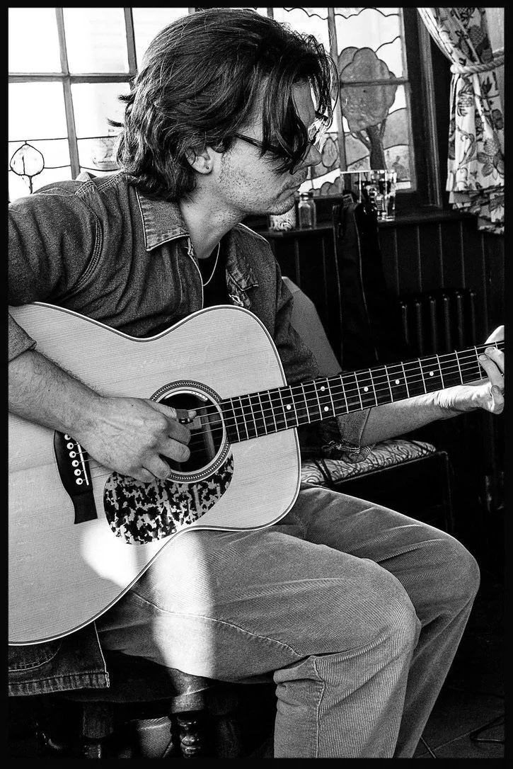 Picture of someone playing guitar with good technique