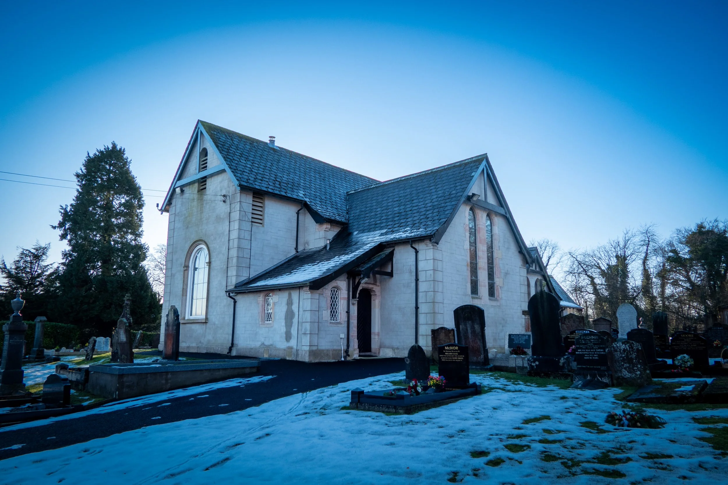 Christ Church Castledawson Church of Ireland, and patches of snow on the ground under a clear blue sky.