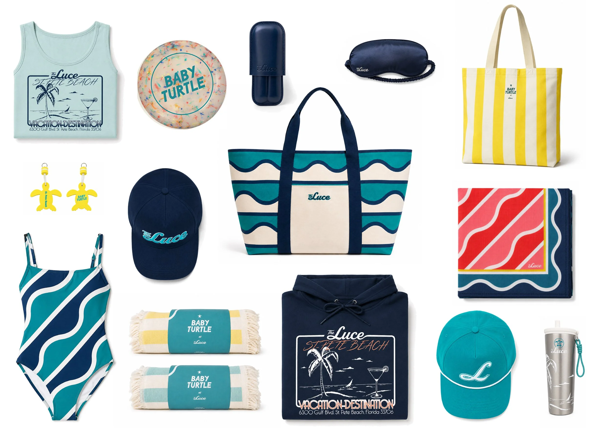 A collection of summer beach accessories and clothing items, including tank tops, a frisbee, a tote bag, beachbag, sleepmask, a tumbler, swimsuit, key chains, 2 rolled up beach towels, a cap, and other beach gear, all with a beach and ocean theme.