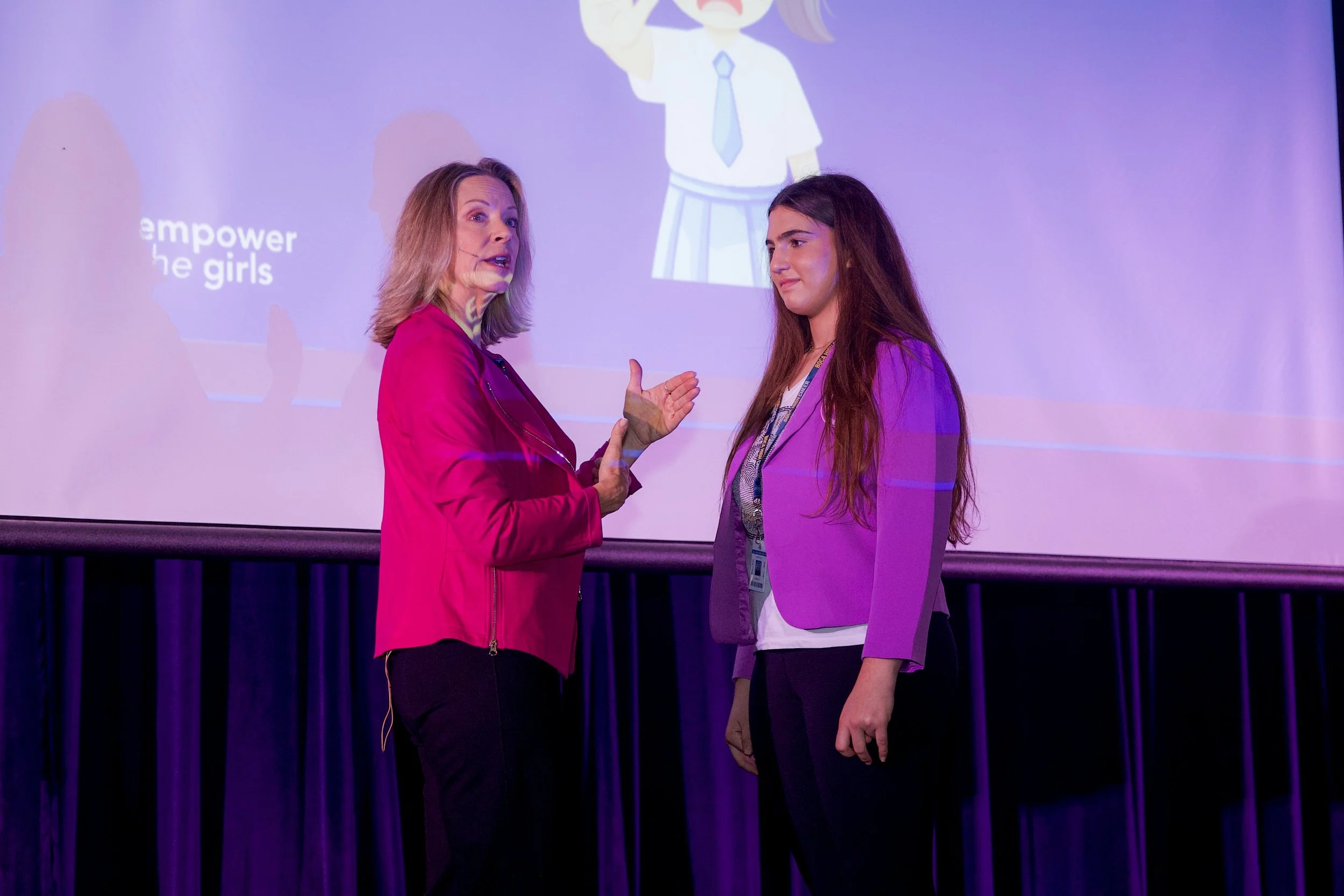 Ellen Claire van Olden on stage. She believes through decision-making strategies, applied practice, and real-world examples, students learn tools they can use immediately—in school, online, socially, and throughout everyday life.