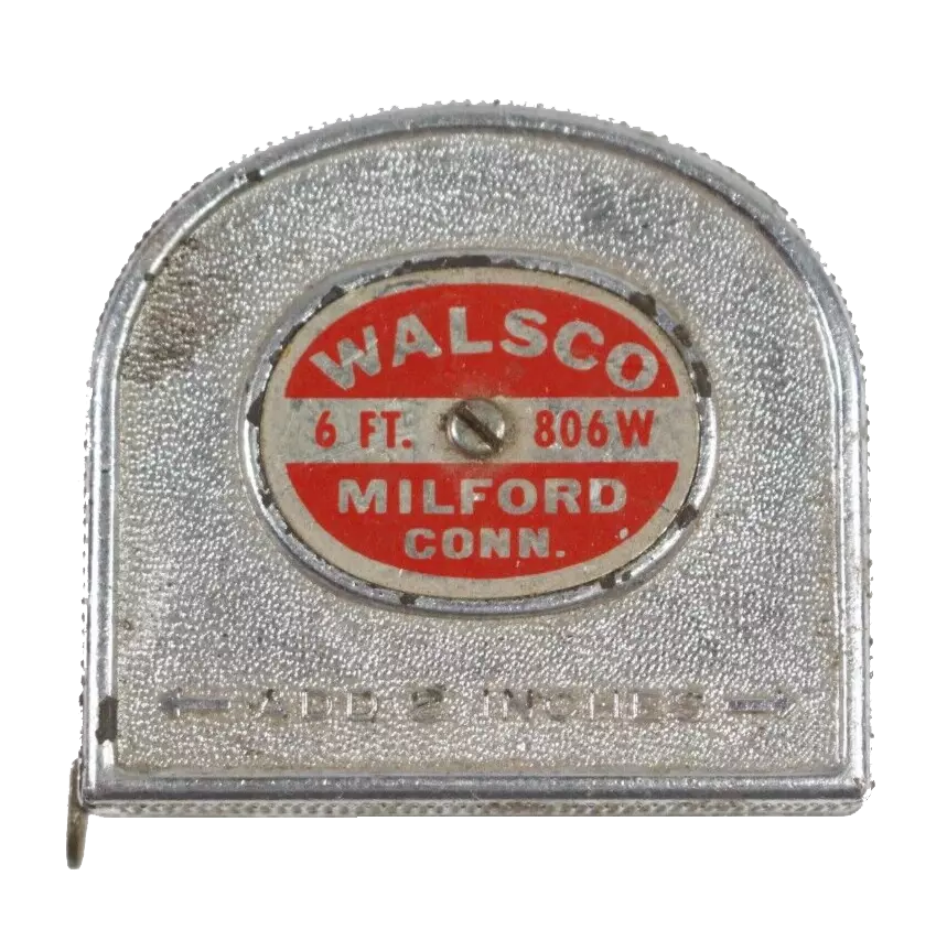 Close-up of a vintage aluminum measuring tape with a red and silver label reading 'WALSCO, 6 ft, 806W, Milford Conn'.