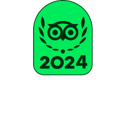Green badge with an owl wearing glasses, laurel wreath, and the year 2024 written below.