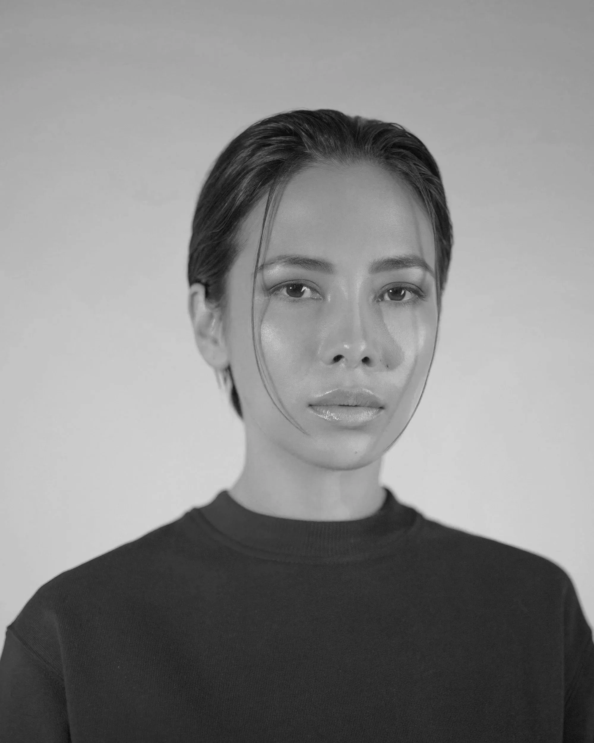 Black and white portrait of a woman looking for deeper purpose work.