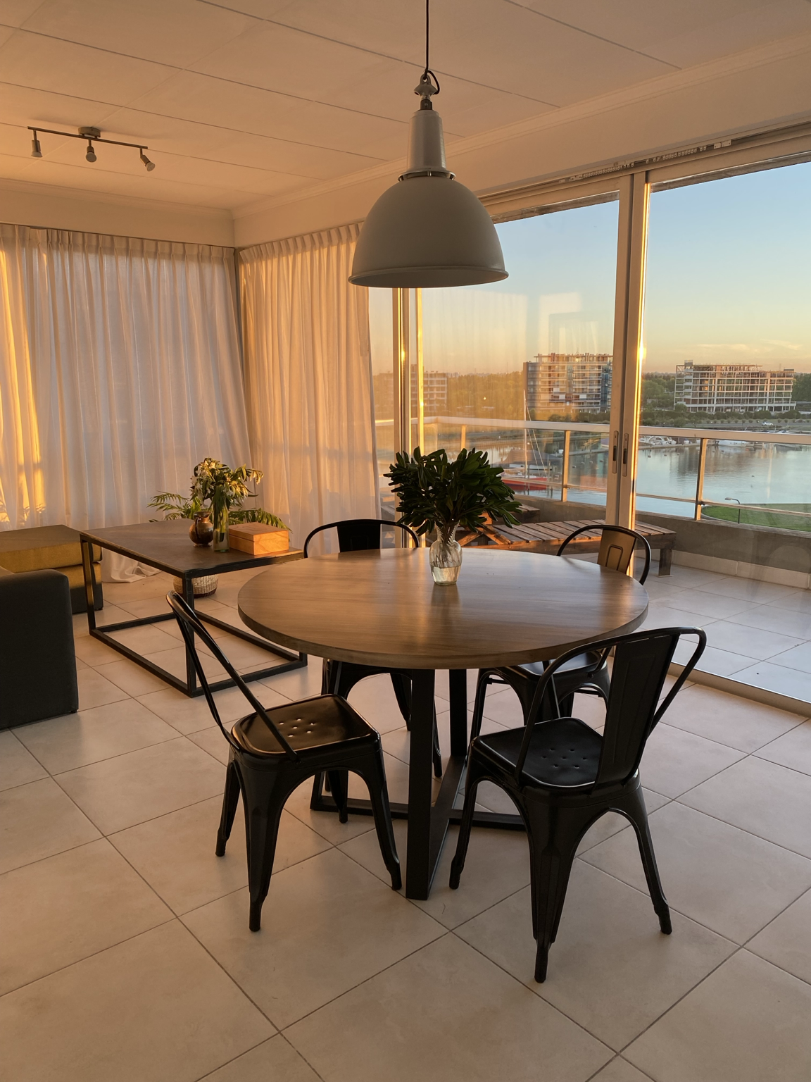 Bright dining room with panoramic river views at Qbay Yacht