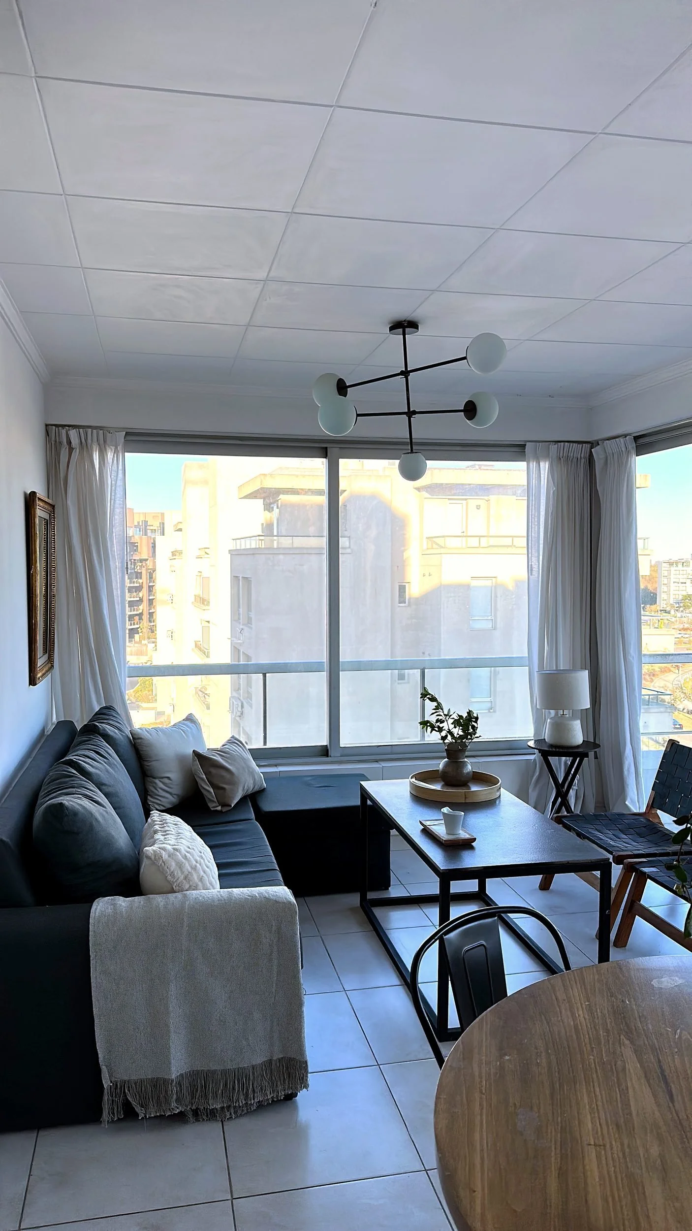 Bright living room with panoramic river views at Qbay Yacht.
