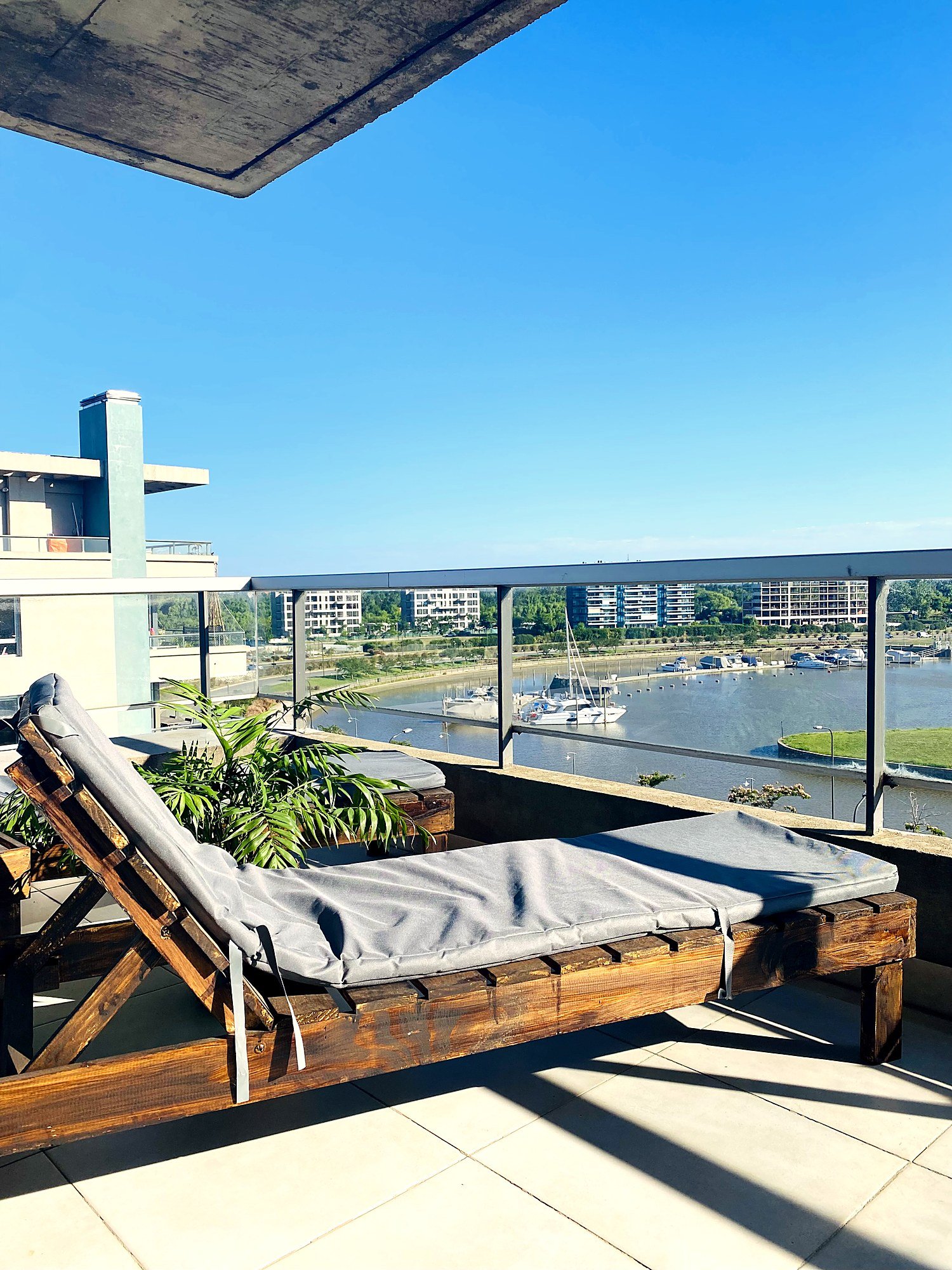 Waterfront balcony overlooking the river at Qbay Yacht, Nordelta. Private Terrace. Riverview and BBQ