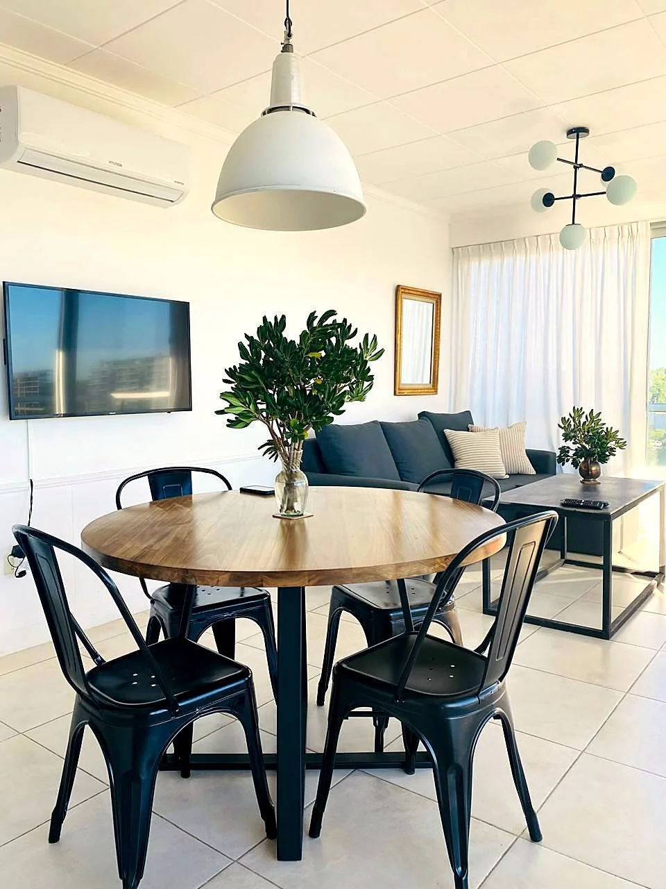 Bright dining room with panoramic river views at Qbay Yacht.