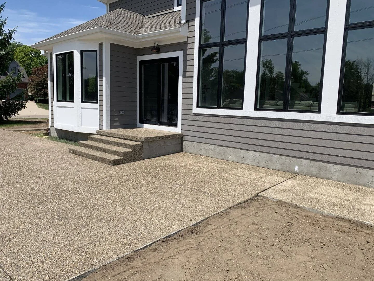 backyard patio with exposed aggregate.jpg