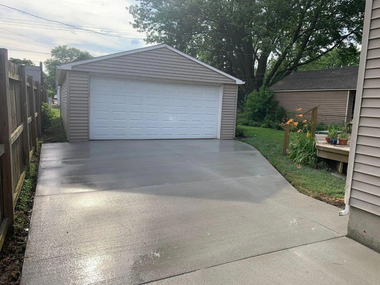 close up of side of house concrete driveway.jpg