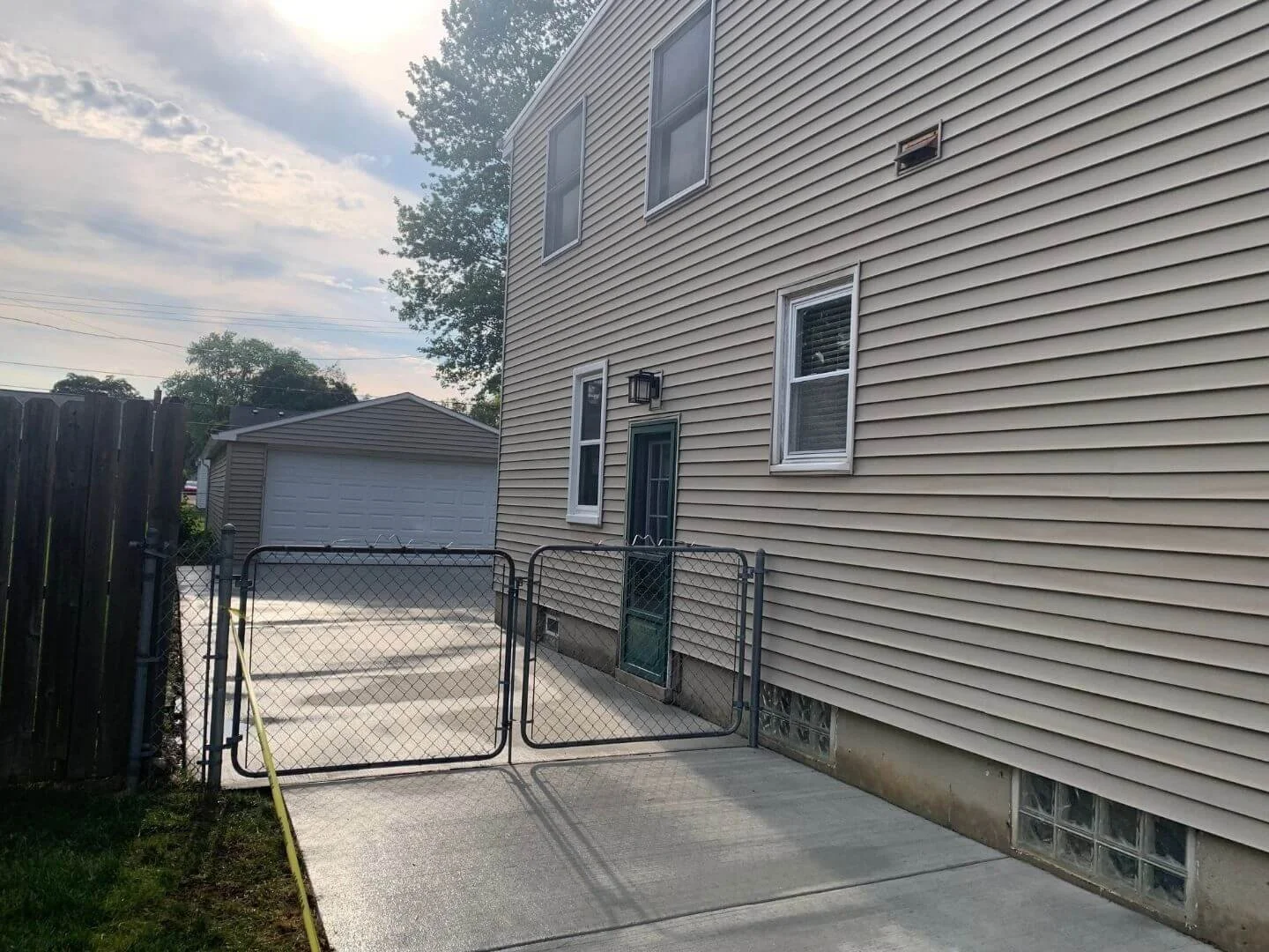 side of house concrete driveway.jpg
