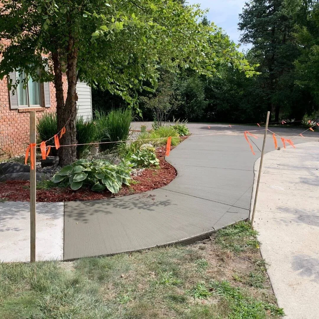 the front of a home with the sidewalk replaced