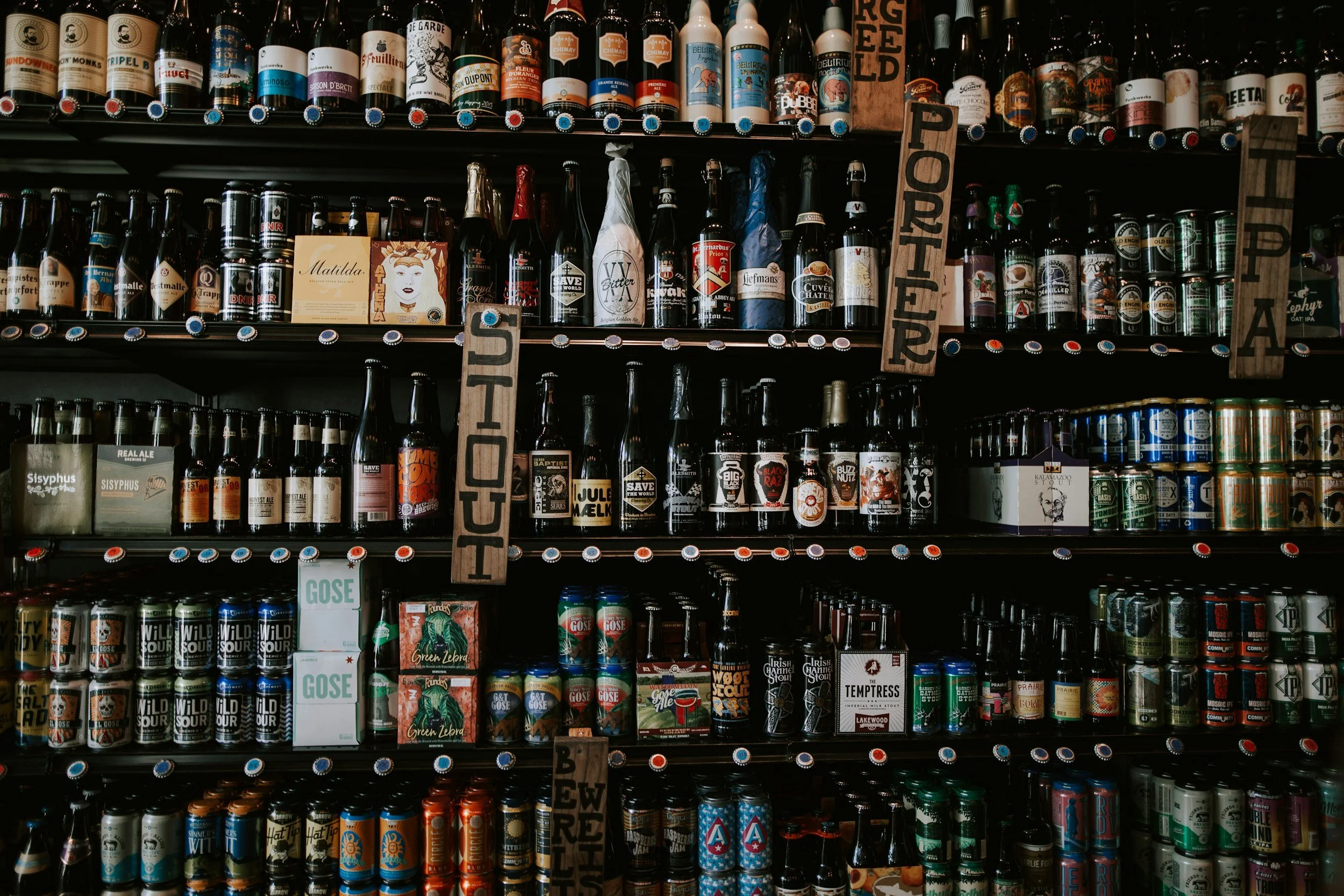 a selection of beer for sale in a store