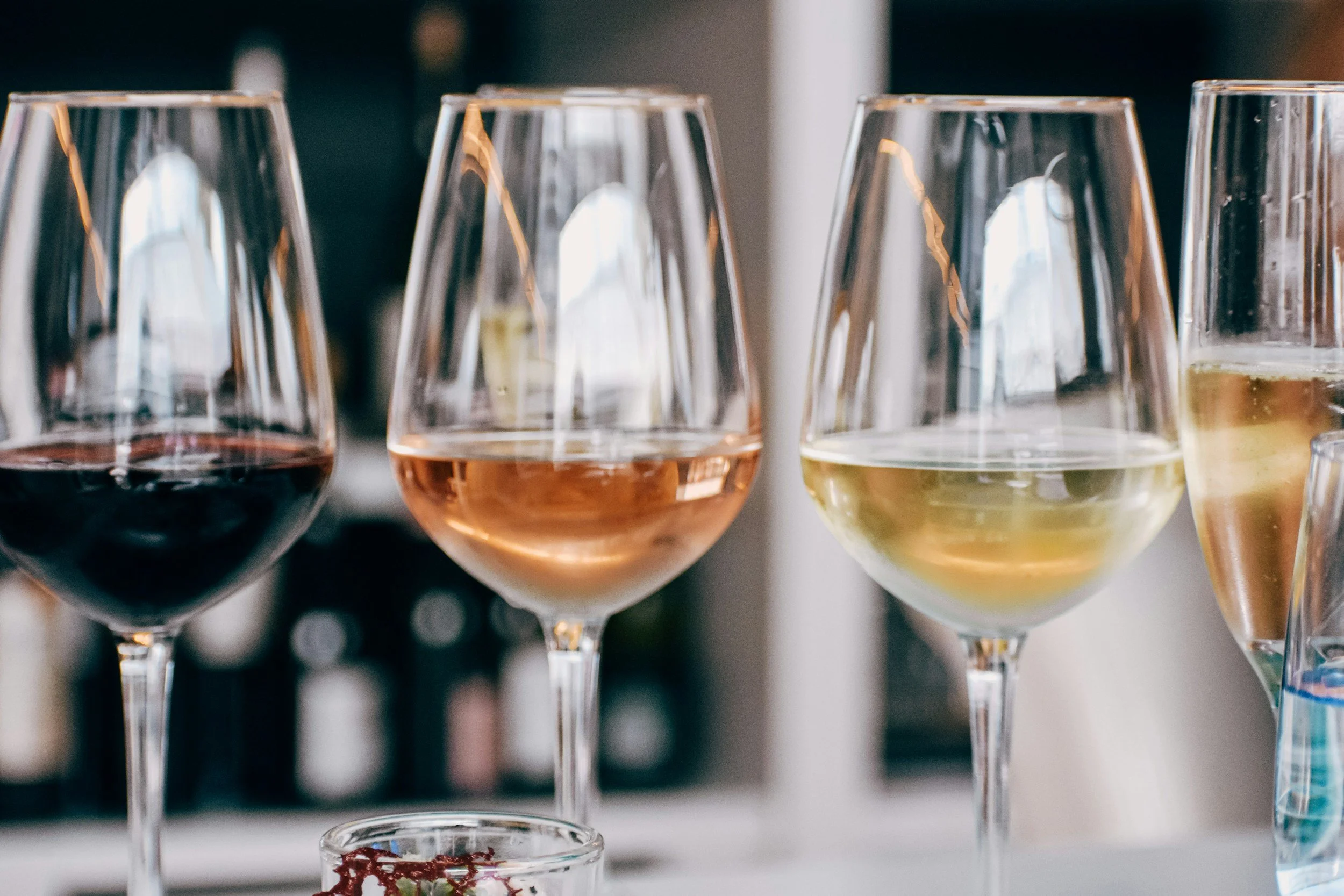 image of wine glasses holding different wines
