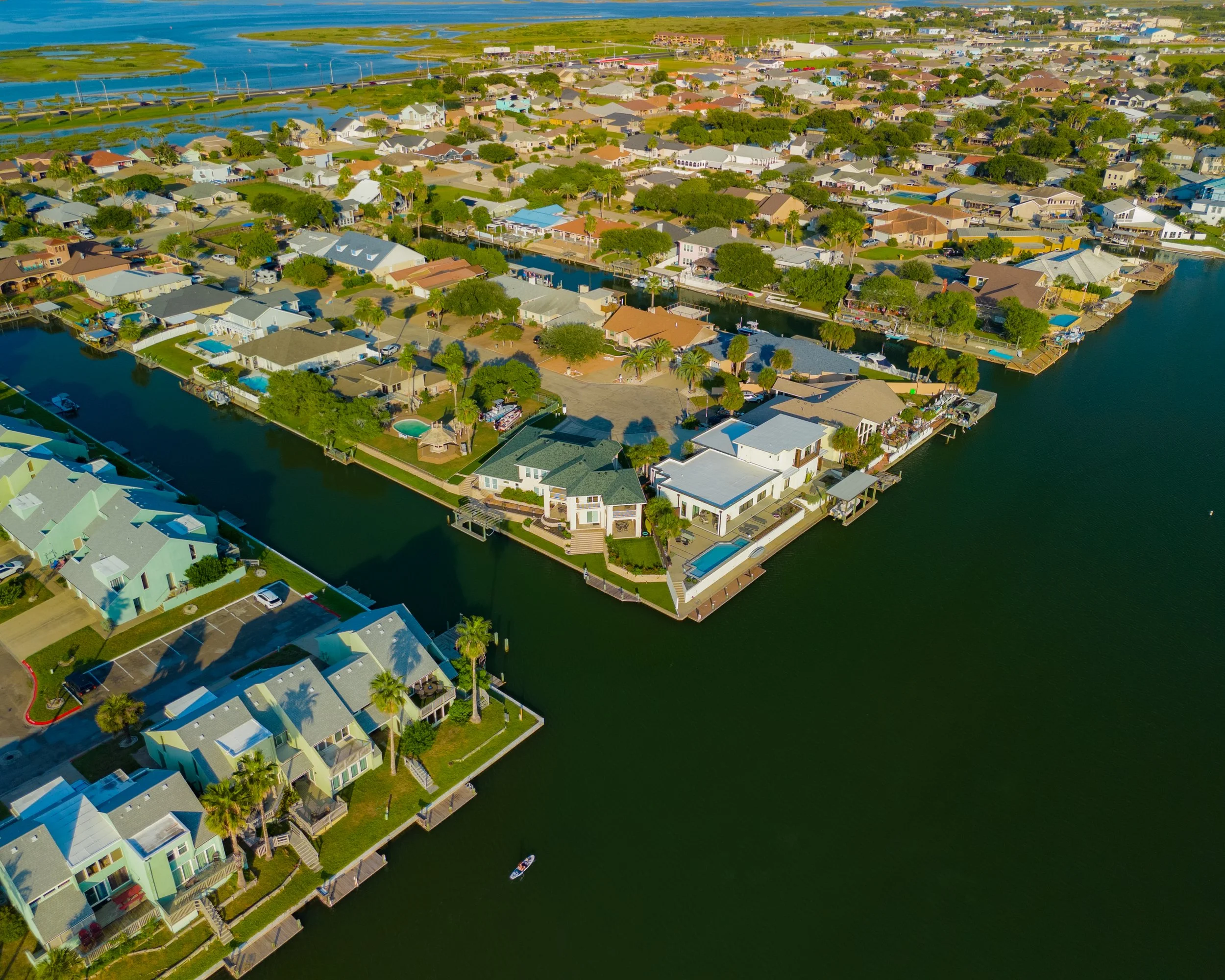 Aerial drone photograph of a waterfront home on Padre Island near Corpus Christi, Texas.