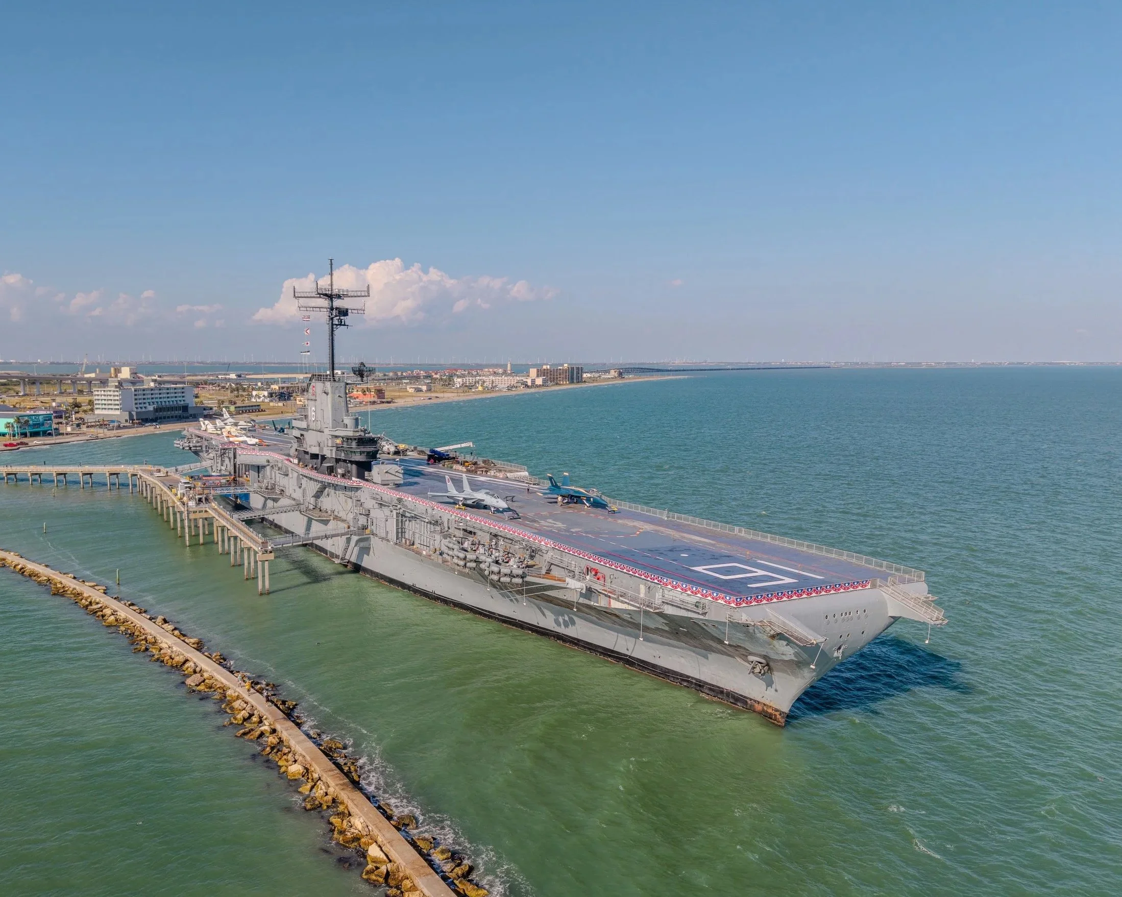 Aerial drone photograph of the USS Lexington Museum overlooking Corpus Christi Bay, Texas.