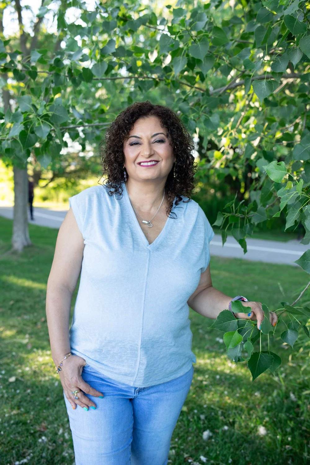 Lucy Shenouda Smiling at Camera in Nature
