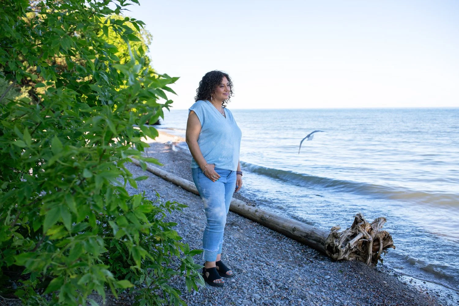 Lucy Shenouda on Beach looking out into distance