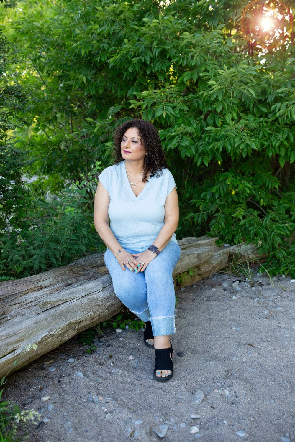 Coach Lucy Shenouda sitting in nature reflecting