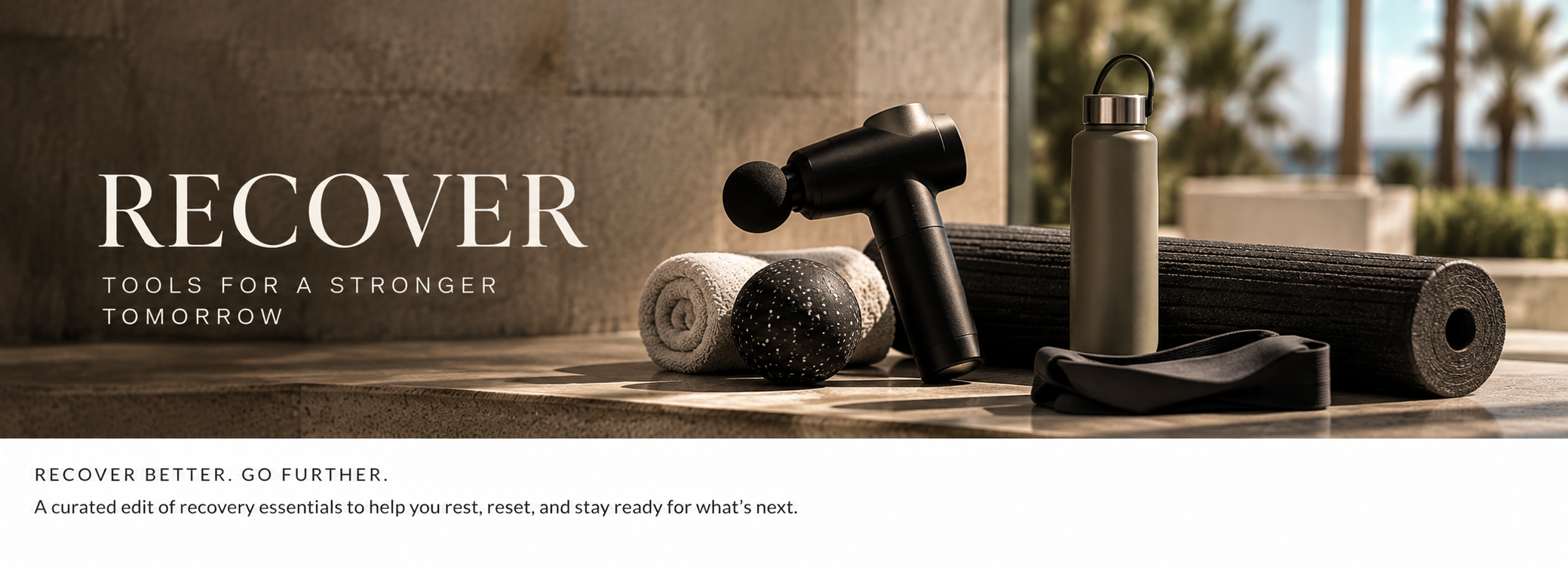 A collection of recovery tools on a surface, including a massage gun, rolled towel, massage ball, water bottle, resistance band, foam roller, and exercise ball, with palm trees visible outside through a window.