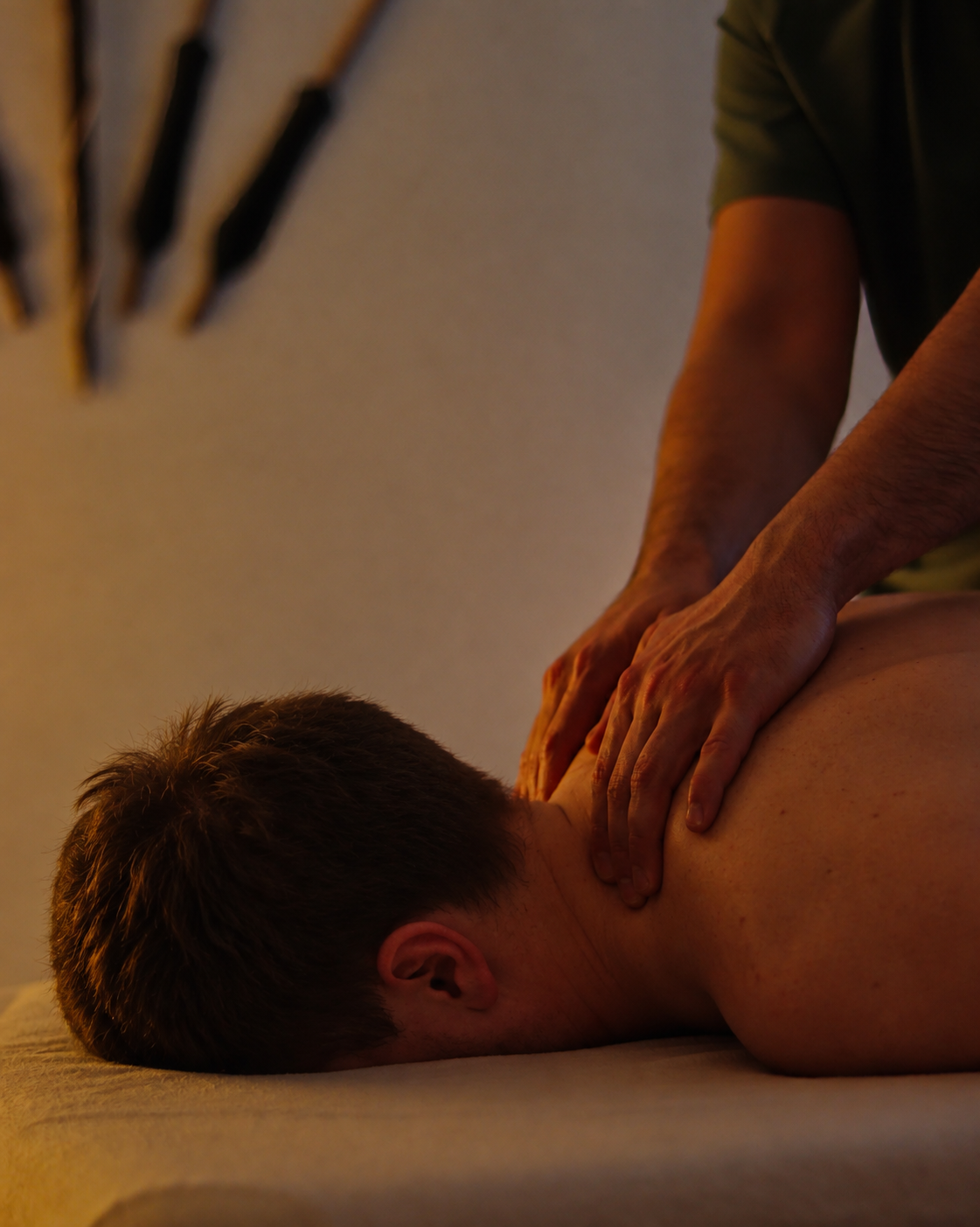 A person receiving a back massage in a relaxing atmosphere.