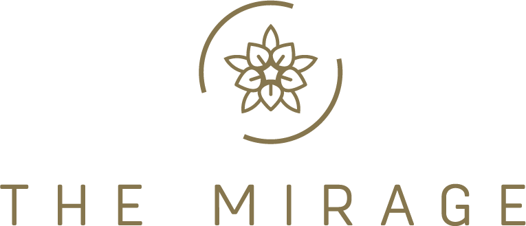 Logo for The Mirage featuring a stylized flower with geometric design within two circles and the text 'The Mirage' below.