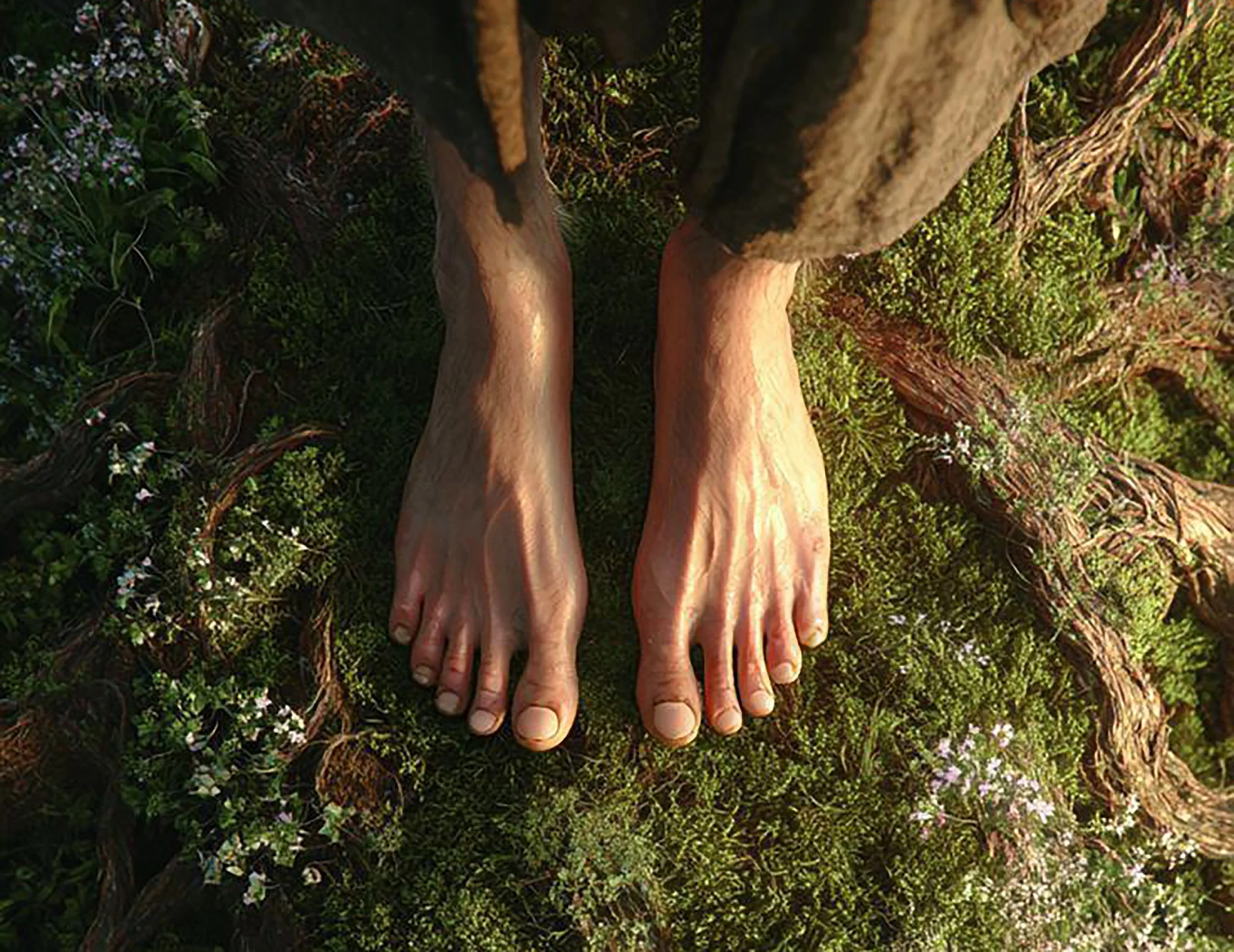 Bare feet standing on green moss