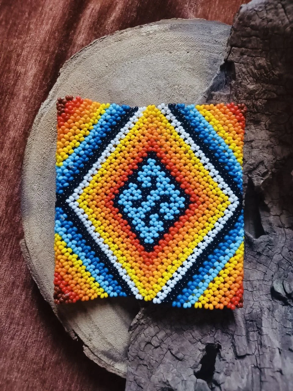 Handmade traditional Bracelet, Alignment. Handcrafted geometric beadwork in vibrant orange, white, and black. Symbolic design inspired by tribal patterns and sacred geometry.