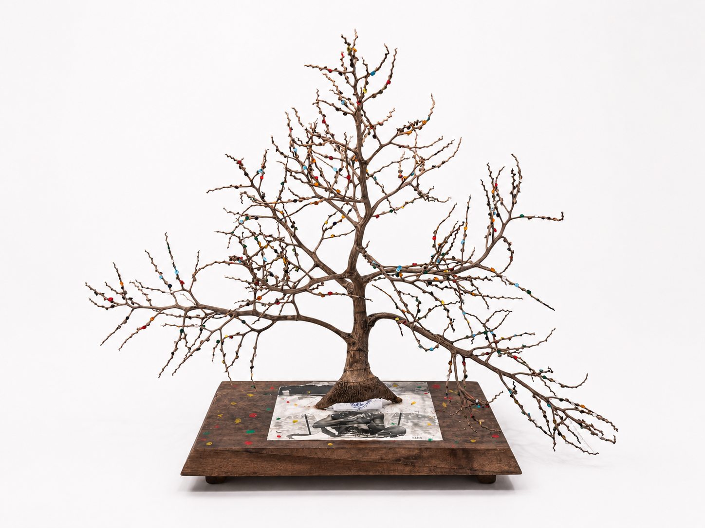 Norman Whittling under the Dot Tree / 2026 / Materials: Coconut tree material, photograph, marker, paint, wood base