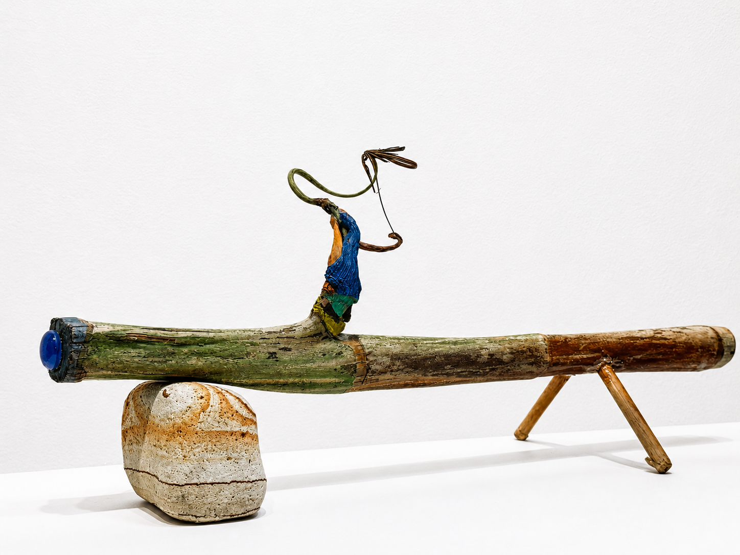 D’Artagnan / 2025 / Materials: Found rock, palm tree trunk, paint