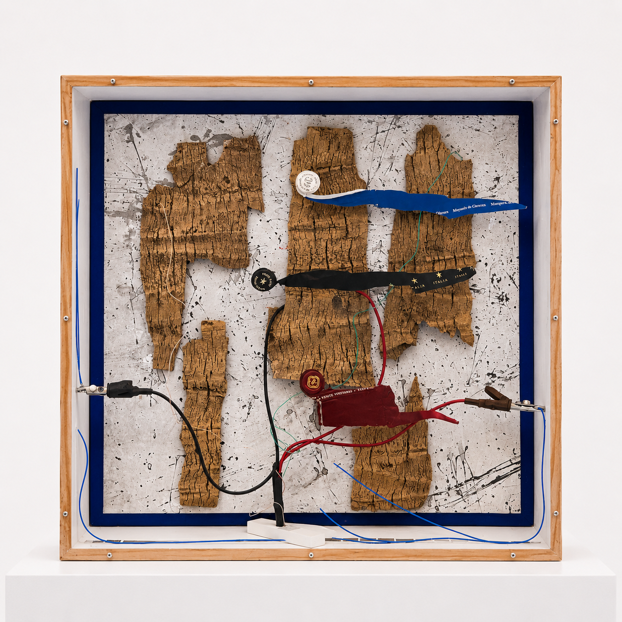 Out of this World 2 / 2020 / Materials: Coconut tree bark, wine bottle foils, painted canvas, elecetrical wire and connectors, wood, photograph clippings, and plexiglass cover
