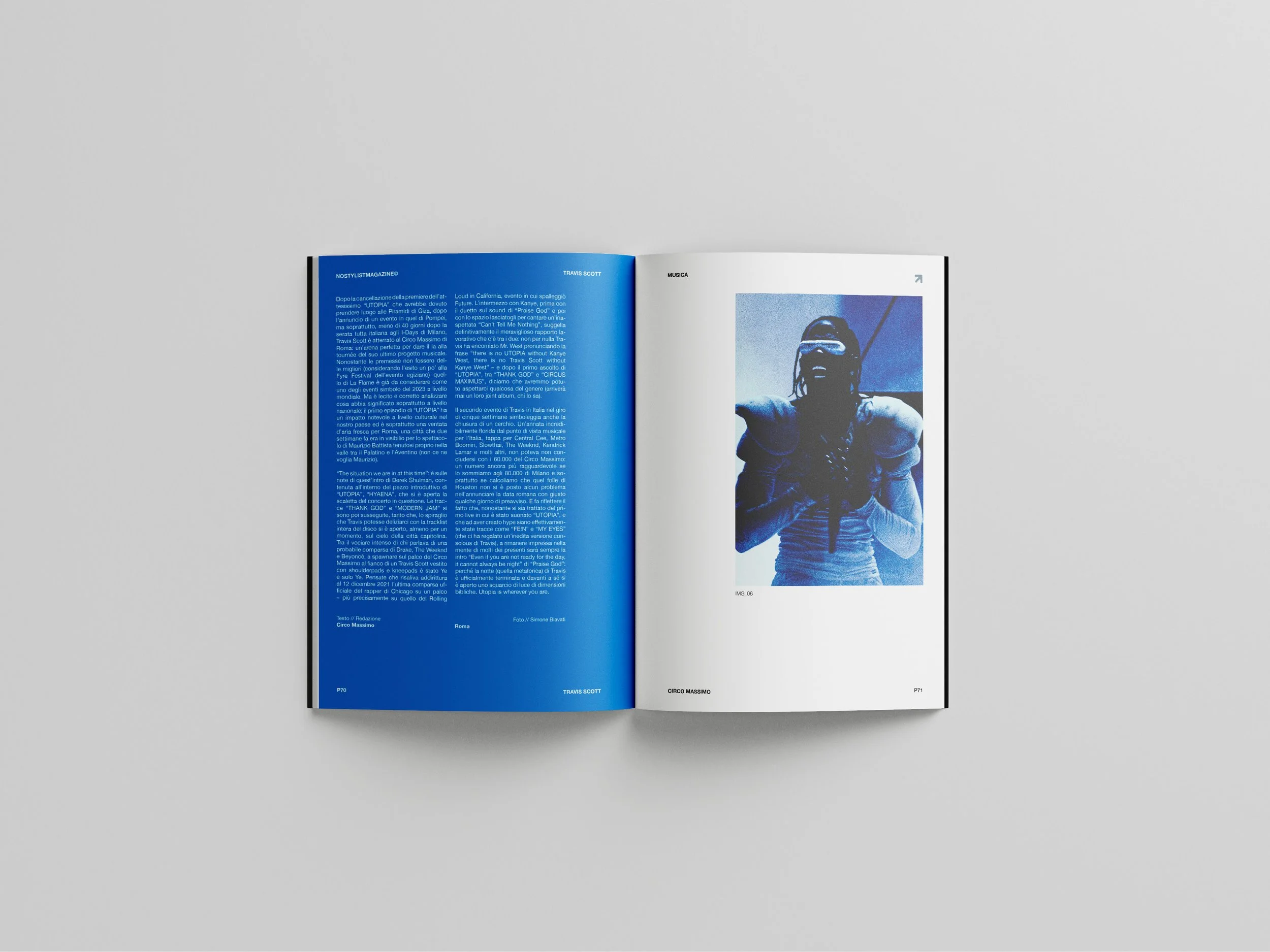 Open magazine on a light gray surface showing two pages, with text on the left page and a photo of a person wearing sunglasses on the right page.