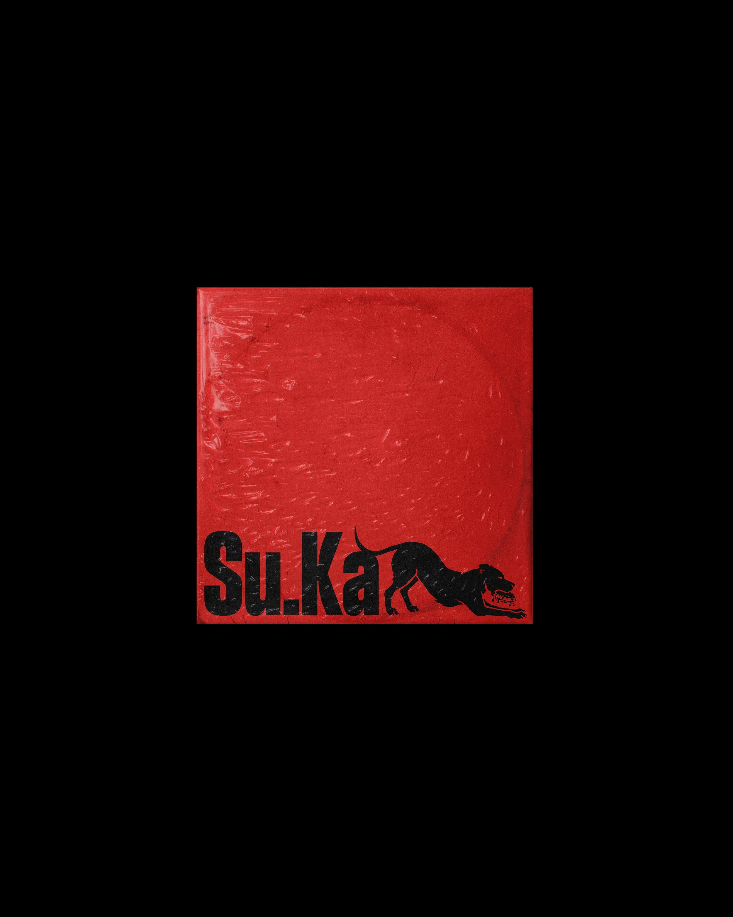 A red box of SurKøra with a black T-Rex silhouette and the text 'SurKøra' on it.