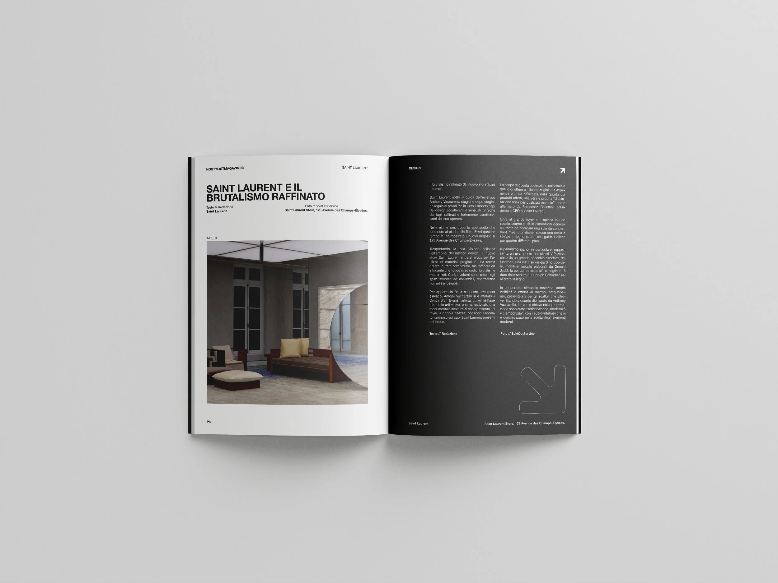 Open magazine shows an article about Saint Laurent with black and white text and a photo of a modern interior with large windows and seating.