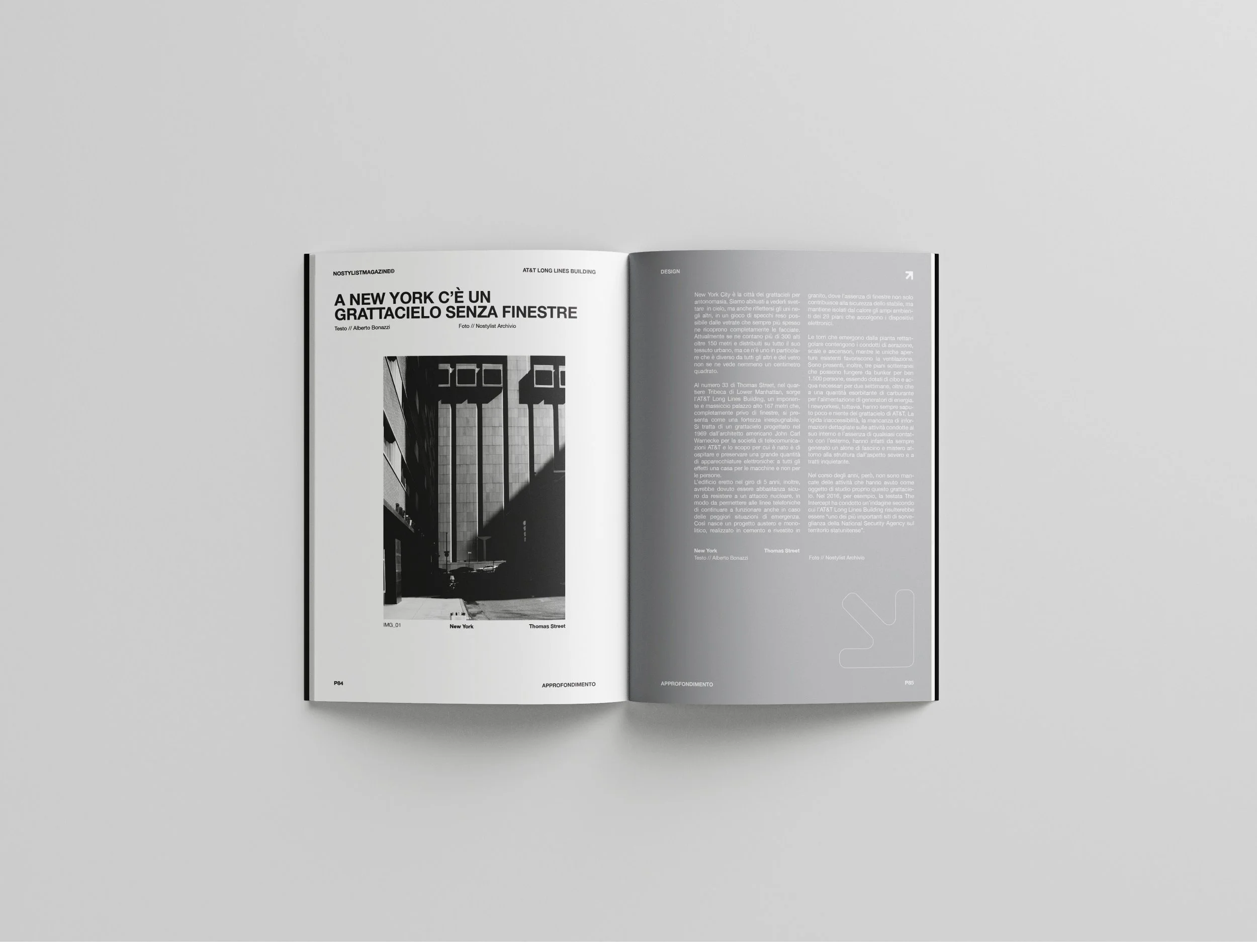 An open magazine displaying black and white architectural photographs and text about New York City and Thomas Street.