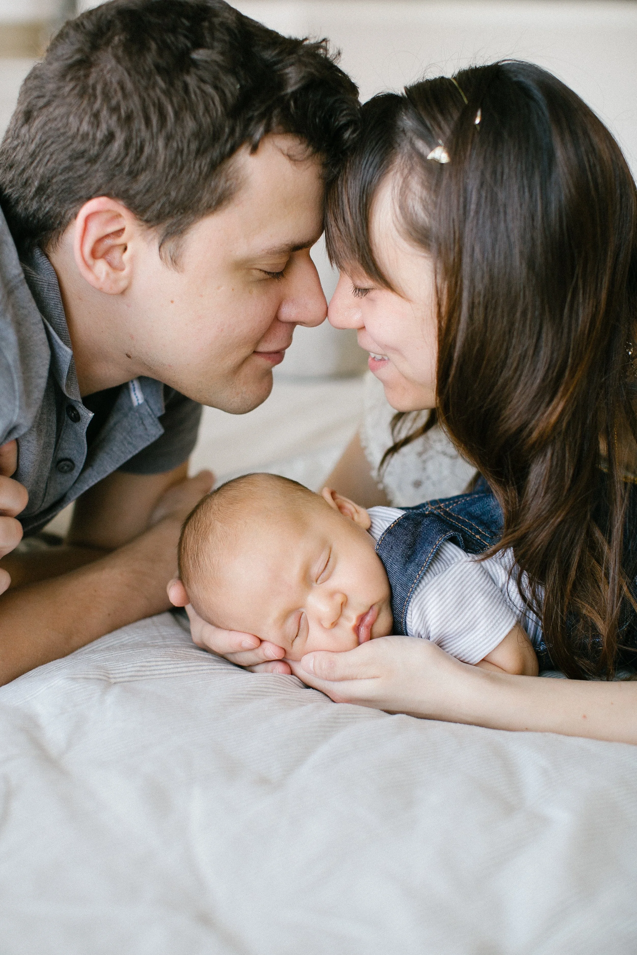 Newborn and maternity photographer specializing in safe, artistic, and heartfelt photography sessions that celebrate the journey of parenthood and capture life's earliest moments.