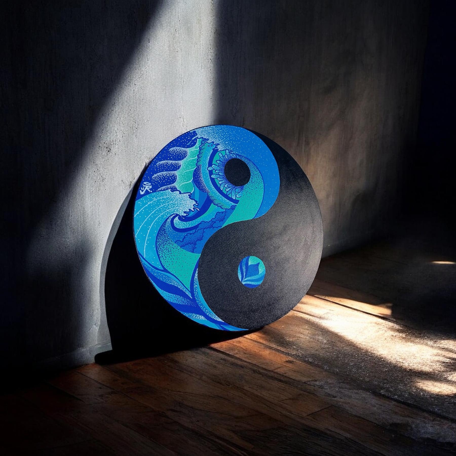 A skateboard deck with a blue and turquoise graphic of a stylized wave and eye, leaning against a dark wall with sunlight casting a shadow, placed on a wooden floor.