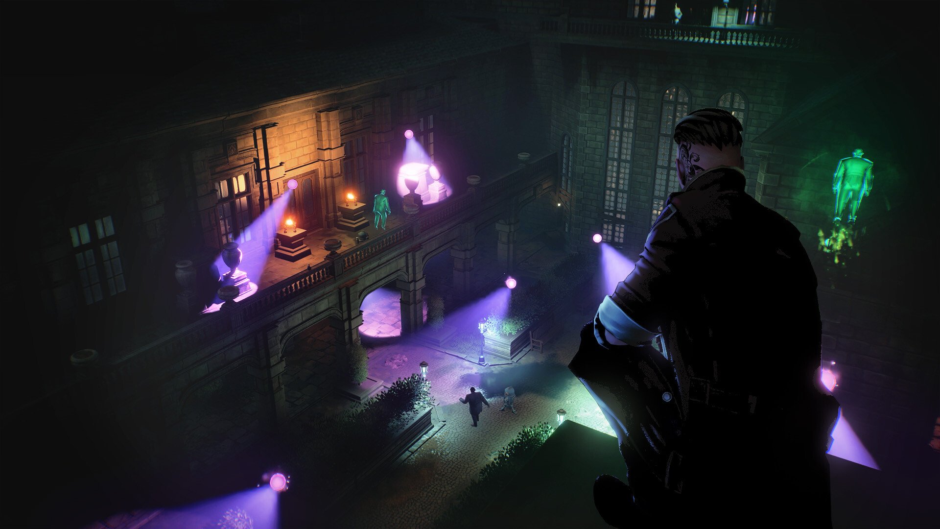 A nighttime scene from a video game showing a character in a dark coat looking down from a balcony of a large, historic building. Below, a city street with people walking and various colorful, glowing statues and lights illuminating the area.