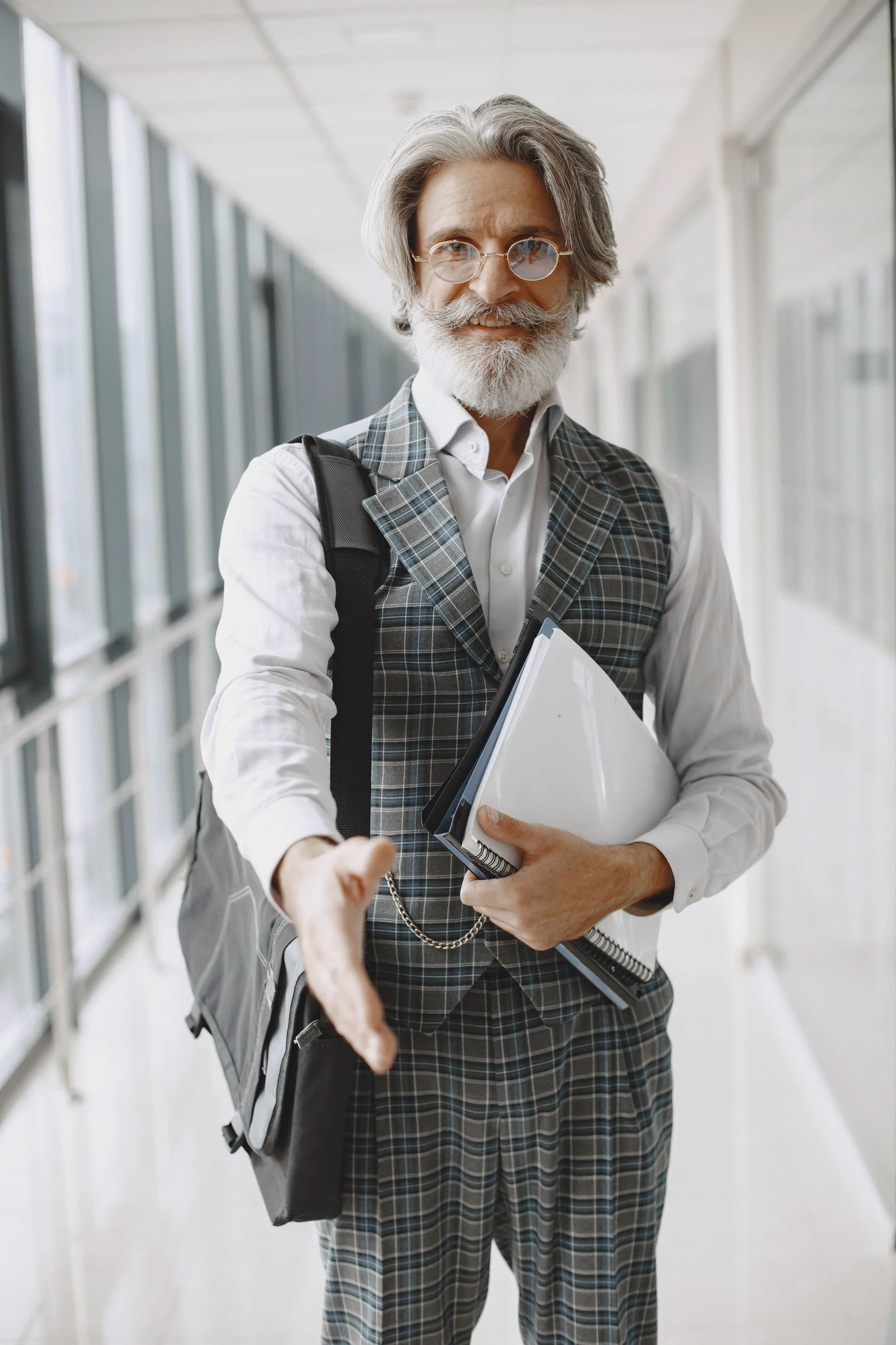 Businessman reaching out to shake hands